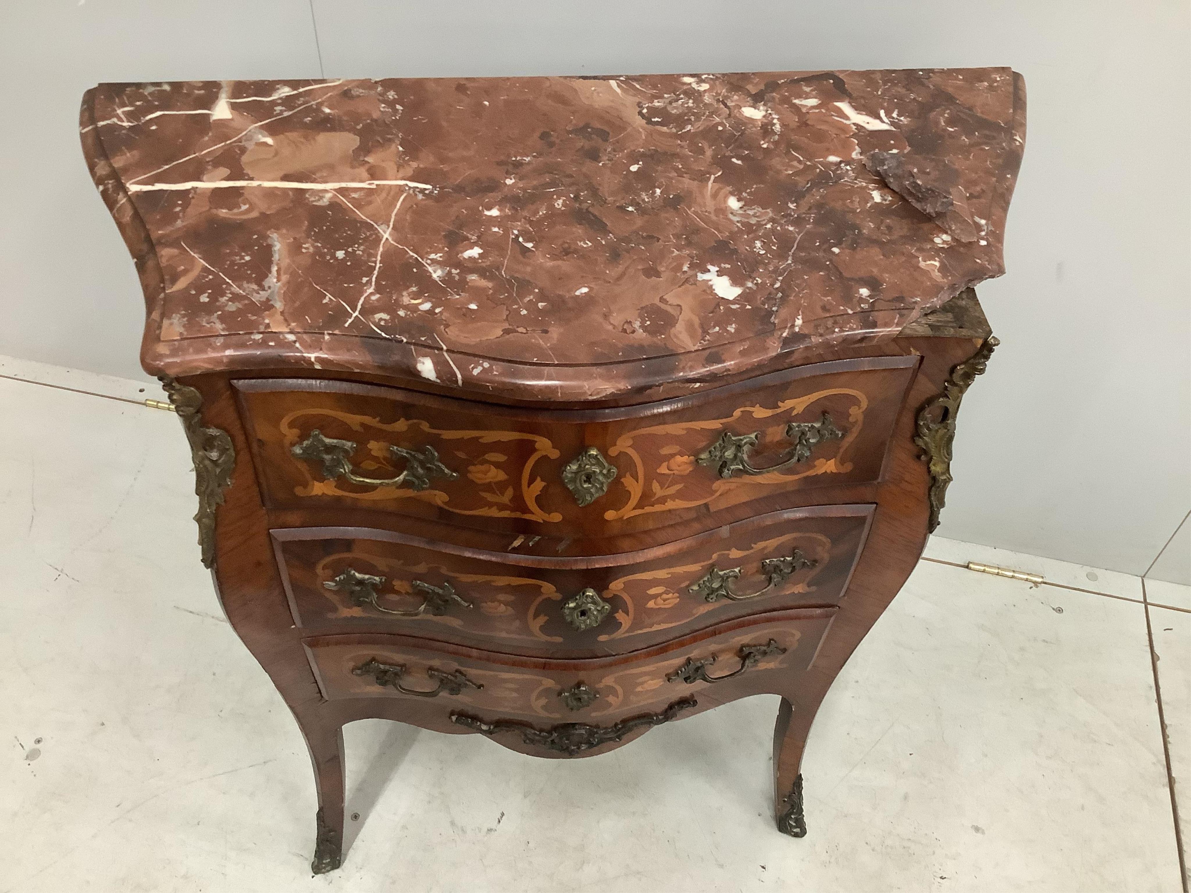 A small French gilt metal mounted marquetry inlaid marble topped bombe commode, width 80cm, depth 38cm, height 86cm. Condition - marble topped corner damaged but piece present